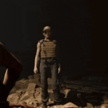 a statue of a man in a hat is standing in the dark