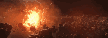 a large explosion with a lot of rocks and a lot of fire