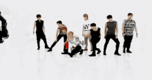 a group of young men are dancing and one of them is wearing a t-shirt that says my