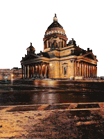 a large building with a dome on top of it is lit up at night