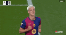 two soccer players are celebrating a goal with the espn logo in the corner