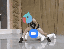 a person with a blue parrot on their face is dancing