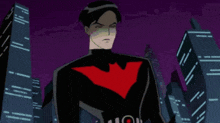 a man in a black suit with a red heart on his chest