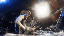 a blurry photo of a person playing a guitar