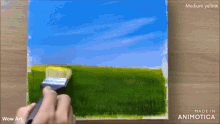 a painting of a grassy field is being painted by wow art