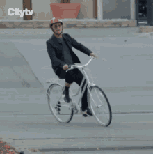Riding A Bike Howie Mandel GIF - Riding A Bike Howie Mandel Canadas Got Talent GIFs