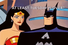 wonder woman and batman from the justice league animated series are standing next to each other .