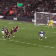 a soccer game is being played on a field with a betway advertisement in the background