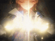 a woman with her eyes closed is holding a light coming out of her hands