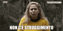 a woman in a yellow sweater says non c ' e struggimento in a foreign language .