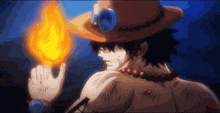 ace from one piece is holding a torch in his hand .