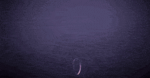 a dark background with purple smoke coming out of the center
