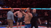 a man in a boxing ring with a sign that says hypnotiq