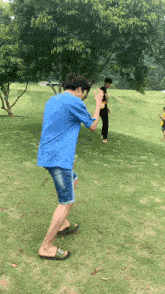 a man wearing flip flops with the letter c on the side
