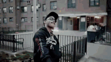 a man wearing sunglasses and a hoodie that says ' los angeles bruins ' on it