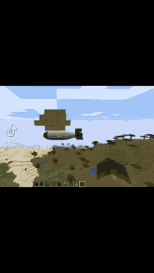 a minecraft video of a plane flying over a desert landscape .