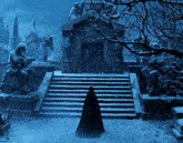 a man in a black cape is standing in front of a cemetery