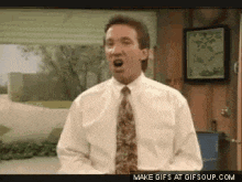 a man in a white shirt and tie is making a funny face with his mouth open