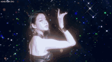 a woman in a black dress stands in front of a honeycam.org logo