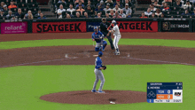 a baseball game is being played with advertisements for seatgeek and reliant on the sidelines