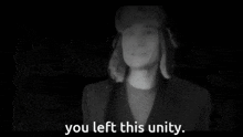 a man in a hat says you left this unity in a black and white photo