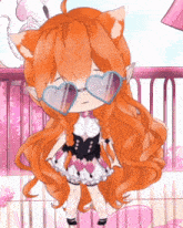 a girl with long orange hair wearing heart shaped glasses