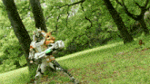 a person in a robot costume is standing in a grassy field