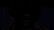 a man with a mask on his face is behind a green stripe .