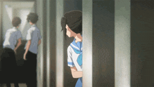 a girl in a blue and white uniform peeking out from behind a door