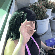 a woman wearing a lanyard that says ' i love you ' on it