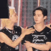 two men are standing next to each other and one is wearing a shirt that says supreme
