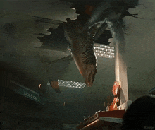 a juice and deli sign hangs from the ceiling