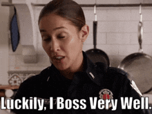 a woman in a police uniform says luckily , i boss very well