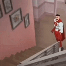 a cartoon character in a red superhero costume is standing on top of a set of stairs .