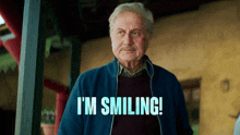 an older man is smiling with the words i 'm smiling