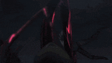 a red light is shining on a dark surface