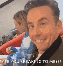 a man is smiling with the words " ate you speaking to me " above him