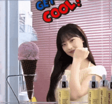a girl is standing in front of a sign that says get cool