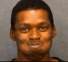 a close up of a man 's face with a funny face .