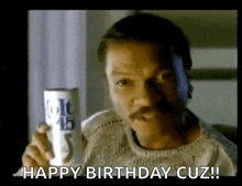 a man with a mustache is holding a can of colt 45 and saying happy birthday cuz !
