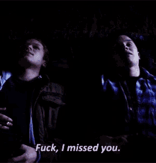 two men are sitting next to each other and one of them says " fuck , i missed you "