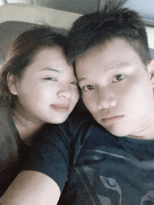 a man and a woman are laying next to each other