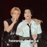 two men standing next to each other with the words heewon de brisa written on the bottom