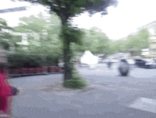 a blurry photo of a person walking down a street
