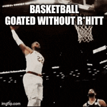 a basketball player with the number 23 on his jersey is dunking a basketball .