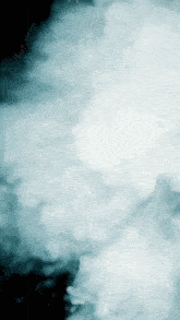 a blue background with a lot of clouds and smoke