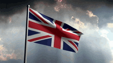 a british flag is waving in the wind