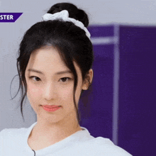 a close up of a girl 's face with a purple background and the word ster on it