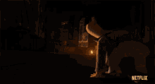 a dark room with a lantern and the word netflix on the bottom