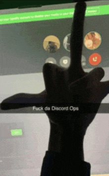 a hand giving the middle finger with the words " fuck da discord ops " written on it